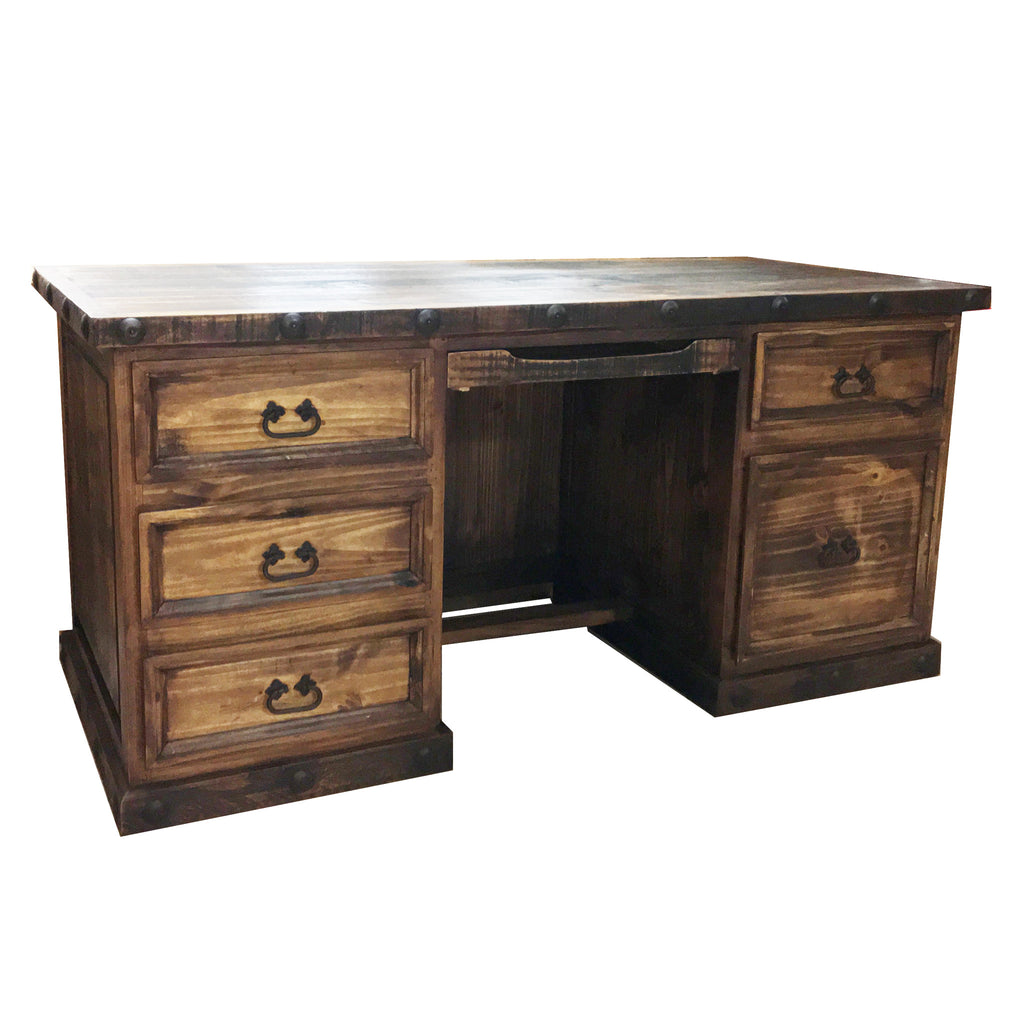 A rustic wooden executive desk with multiple drawers, featuring a spacious work surface, iron pulls, and a filing drawer. The desk is brown in color and appears to be sturdy and well-crafted.