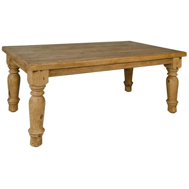 A rustic Santa Rita 6' dining table made of pine wood with a medium brown tone wax finish, featuring classic turned legs.
