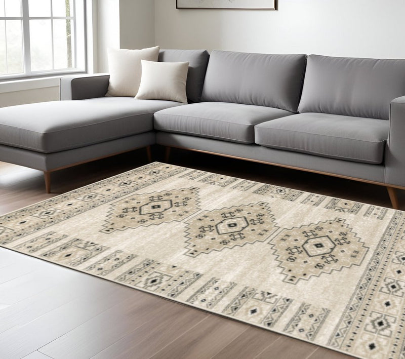 6' X 9' Ivory Grey Black And Ivory Southwestern Power Loom Stain Resistant Area Rug