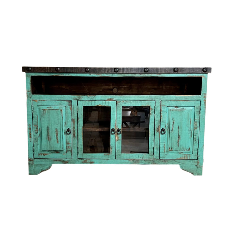 Rustic wooden entertainment console with turquoise doors in a home setting.
