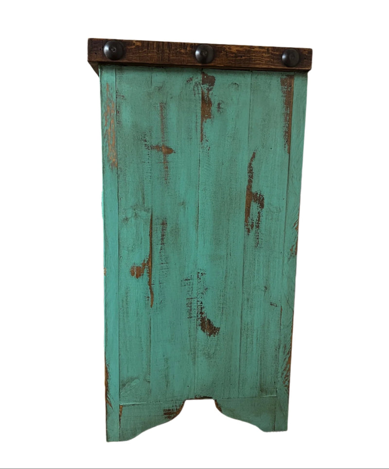 Rustic wooden table with a distressed turquoise top in a room setting.