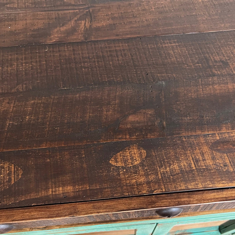 Close-up of a wooden surface with a green and brown color scheme.